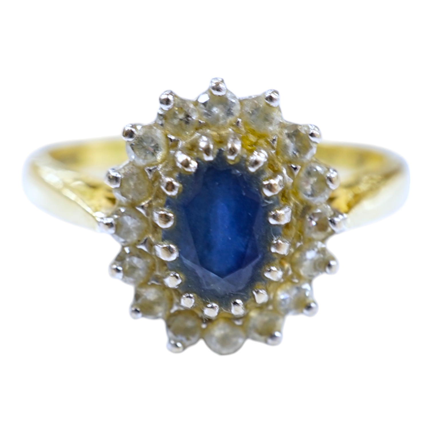 A modern 18ct gold, sapphire and diamond set oval cluster ring, size P/Q, gross weight 4.9 grams. Condition - fair